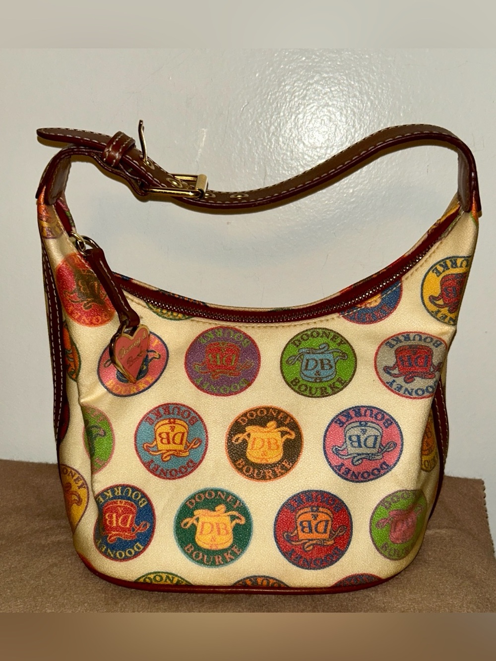 Dooney & Bourke Coated Canvas Medallion Hobo Bag. Y2K